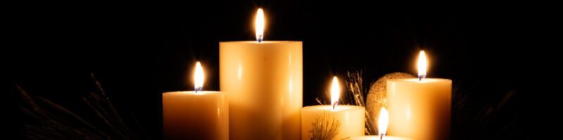seasonal christmas candles burning as part of a holiday decoration
