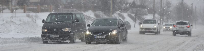 cars driving in light snow
