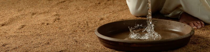 pouring water in the basin for the ordinance of humility